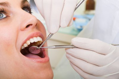 Dentist treating the patience
