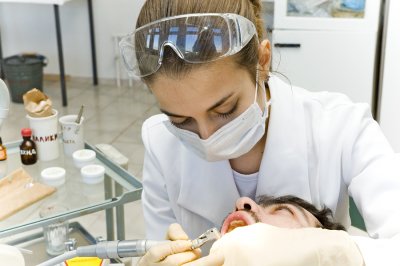 Dentist is examining the patient