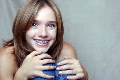 Young girl with braces smiling