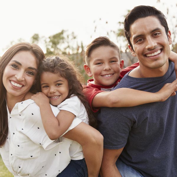 smiling family of four