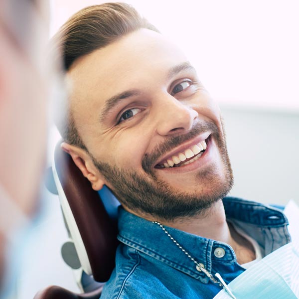 man smiling in dental chair