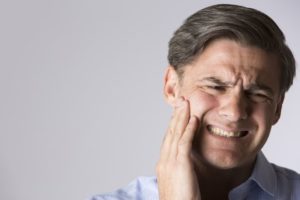 A man catching his mouth