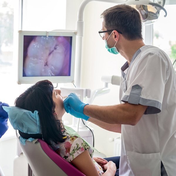 doctor examining dental patient