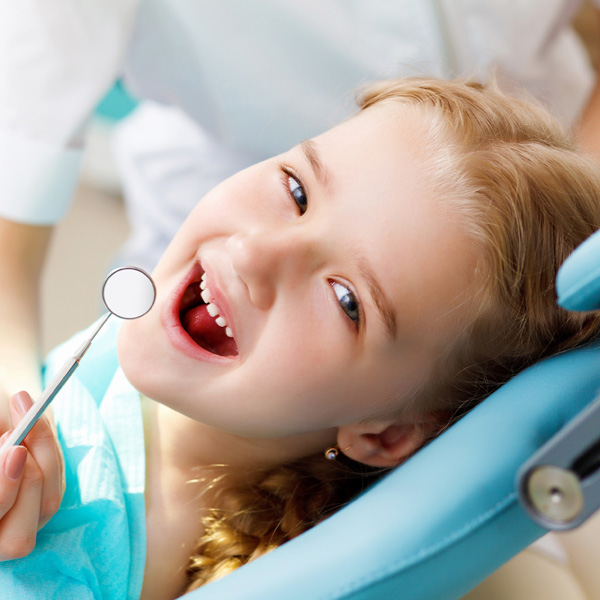 young girl at the dentist